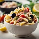 Fresh ingredients for Mediterranean pasta salad on kitchen counter