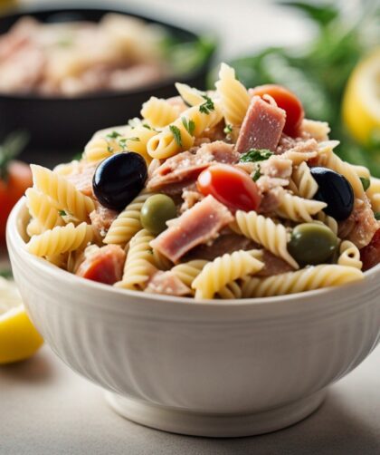 Fresh ingredients for Mediterranean pasta salad on kitchen counter